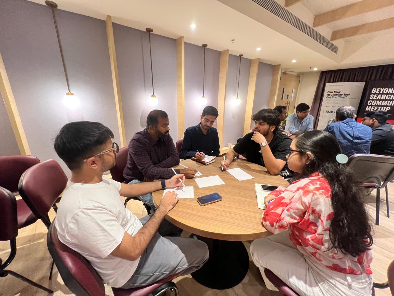 A discussion table beside the Beyond Search Community banner