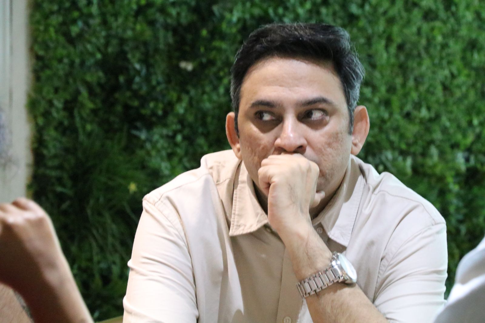 An attendee listening closely during a session